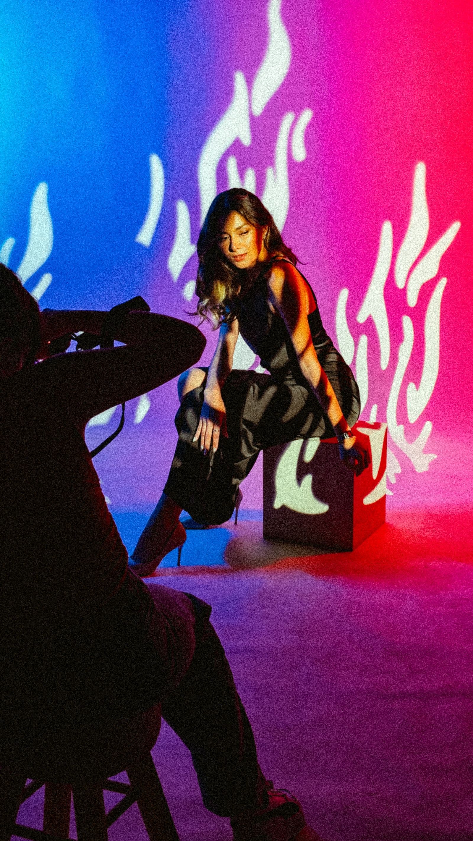 Creator directing a colourful editorial photoshoot